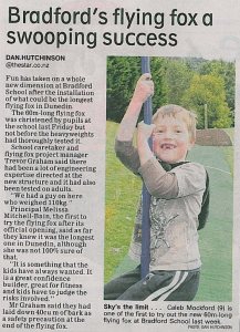 A child having fun on a local Dunedin School's new Flying fox.