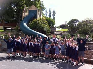 Excited children waiting for a first go on their new Playgear™ Tunnel Slide.